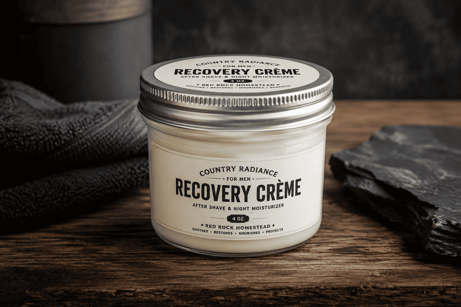 Recovery Crème jar for men on wooden surface with slate and towel.